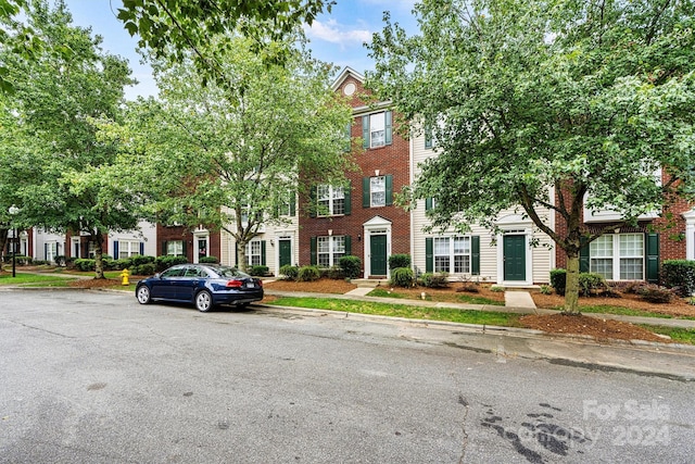 view of front of house with brick siding