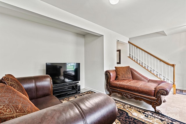 living area with stairway and baseboards