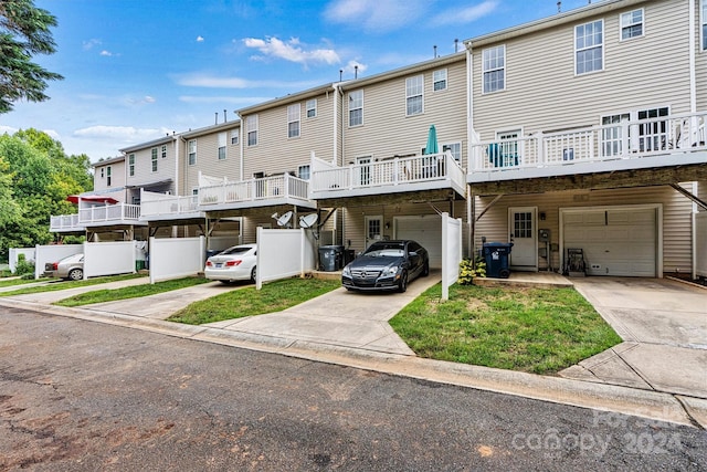 exterior space with a balcony and a garage