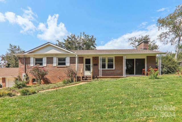 ranch-style home with a front lawn