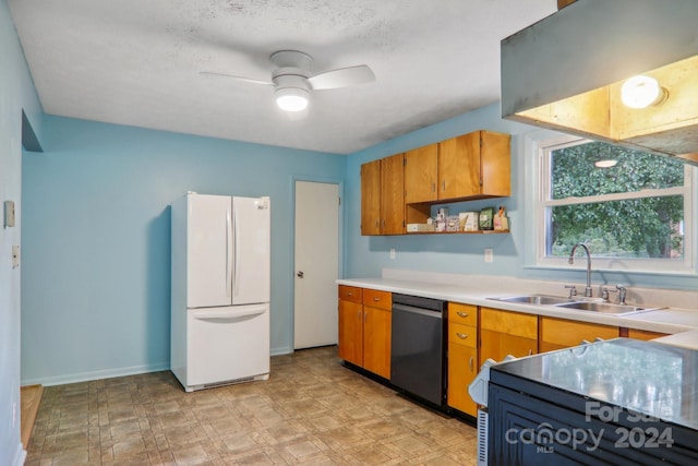 kitchen featuring sink, dishwasher, ceiling fan, and white refrigerator