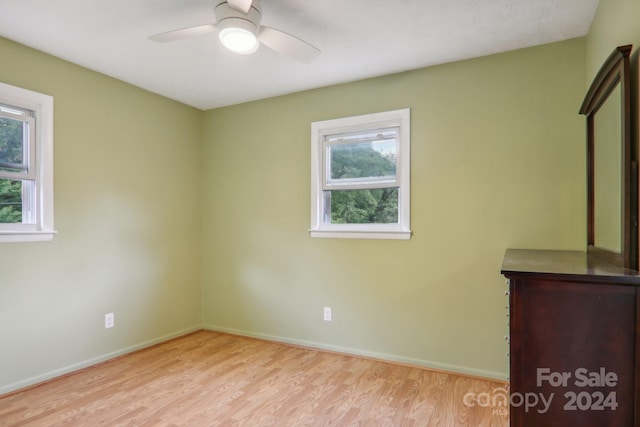 unfurnished room featuring ceiling fan and light hardwood / wood-style floors