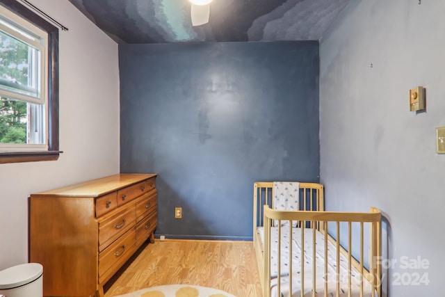 bedroom featuring ceiling fan and light wood-type flooring