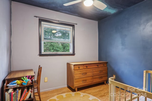 bedroom with light wood-type flooring and ceiling fan