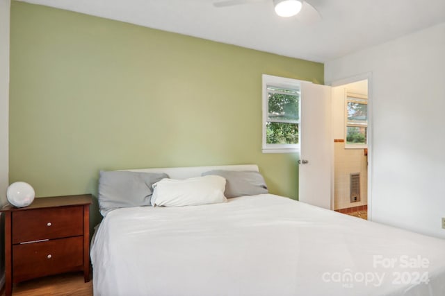 bedroom with ceiling fan and hardwood / wood-style flooring