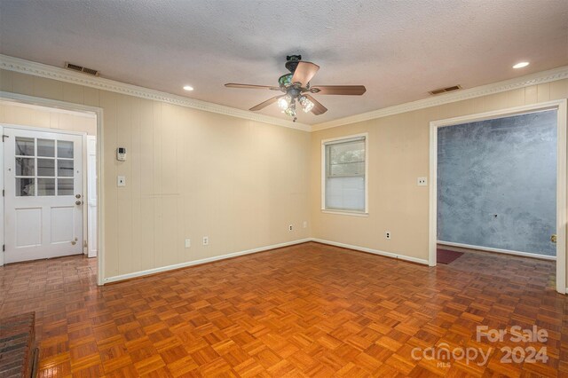 unfurnished room featuring parquet floors, ceiling fan, crown molding, and a textured ceiling