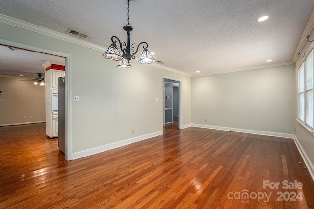 interior space featuring ceiling fan with notable chandelier, crown molding, hardwood / wood-style flooring, and a textured ceiling