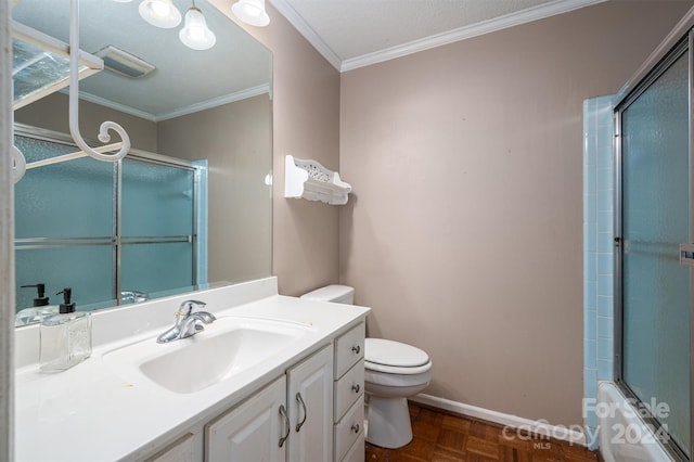 full bathroom with toilet, parquet floors, combined bath / shower with glass door, vanity, and ornamental molding