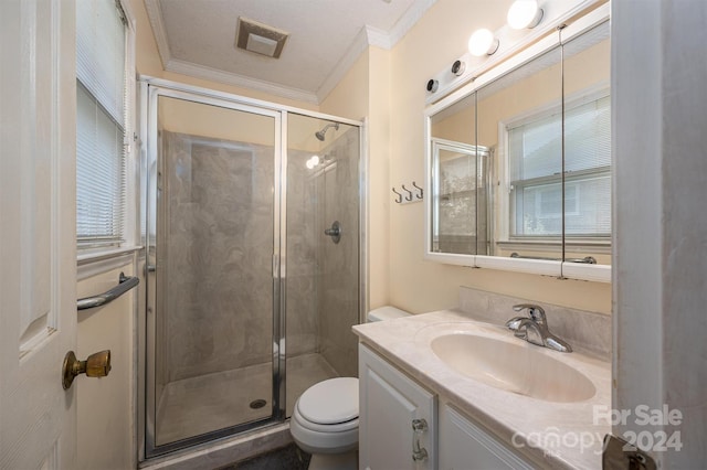 bathroom featuring toilet, walk in shower, ornamental molding, vanity, and a textured ceiling