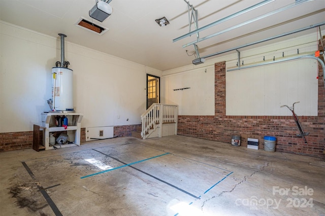 garage featuring a garage door opener and water heater