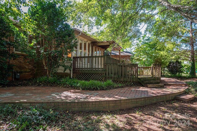 exterior space featuring a patio and a deck