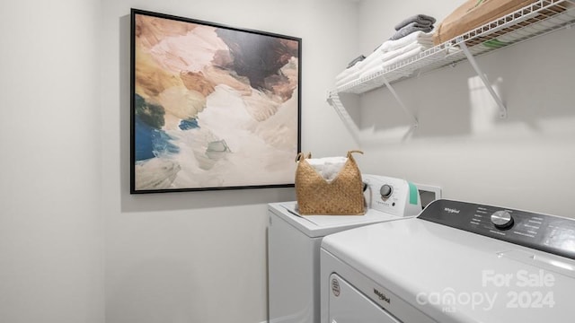 clothes washing area featuring independent washer and dryer