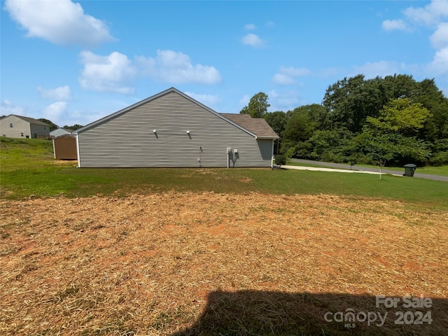 view of property exterior featuring a lawn