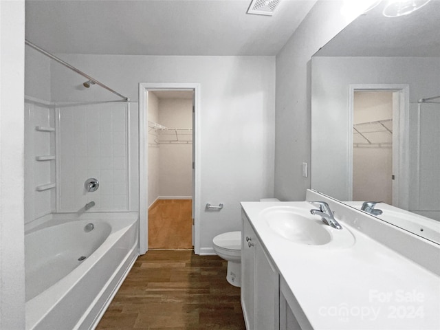 full bathroom featuring vanity, hardwood / wood-style floors, toilet, and shower / bath combination