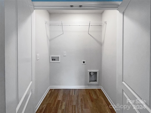 laundry room with electric dryer hookup, hookup for a washing machine, and dark wood-type flooring