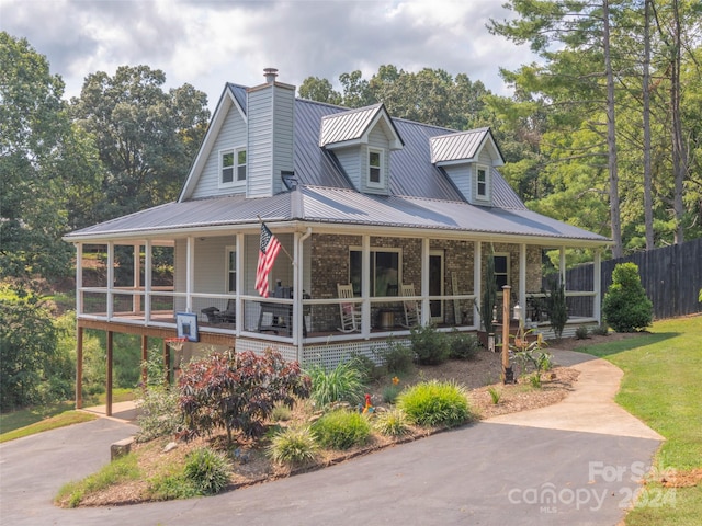 country-style home featuring covered porch