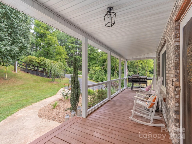 deck featuring a lawn