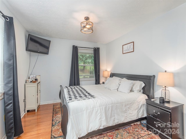 bedroom featuring hardwood / wood-style floors