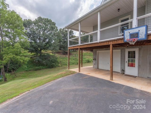 view of patio / terrace featuring a garage