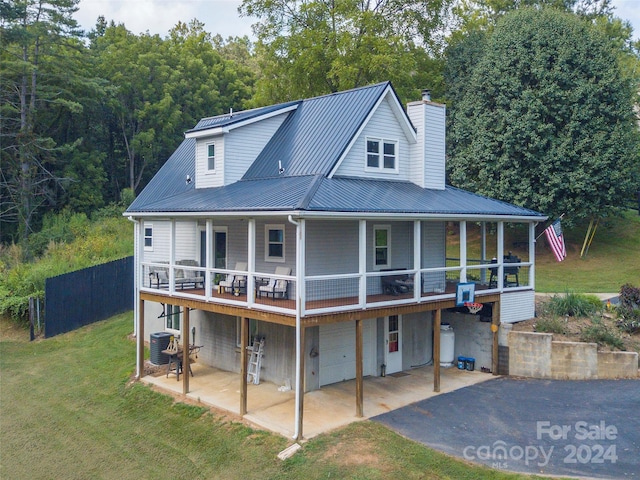 rear view of property with central AC and a lawn