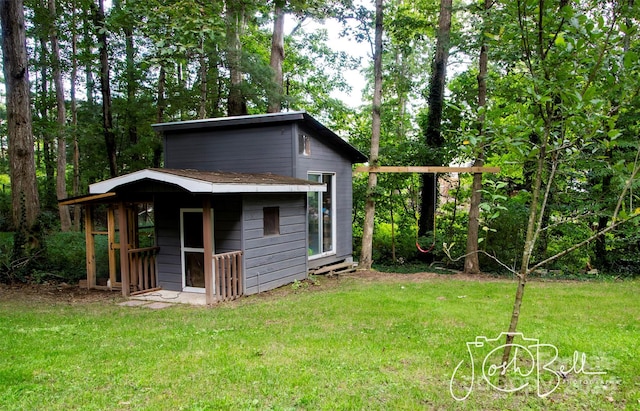 view of outdoor structure with a lawn