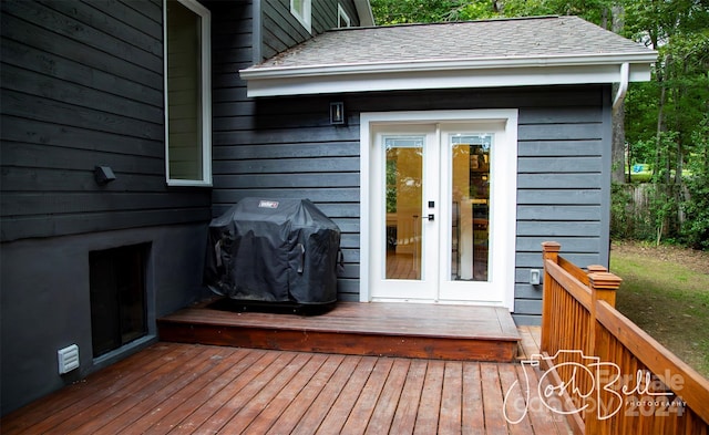 wooden terrace featuring french doors and grilling area