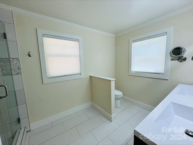 bathroom with vanity, a shower with shower door, ornamental molding, and toilet