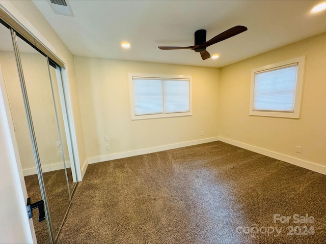 unfurnished bedroom with ceiling fan, carpet floors, and a closet