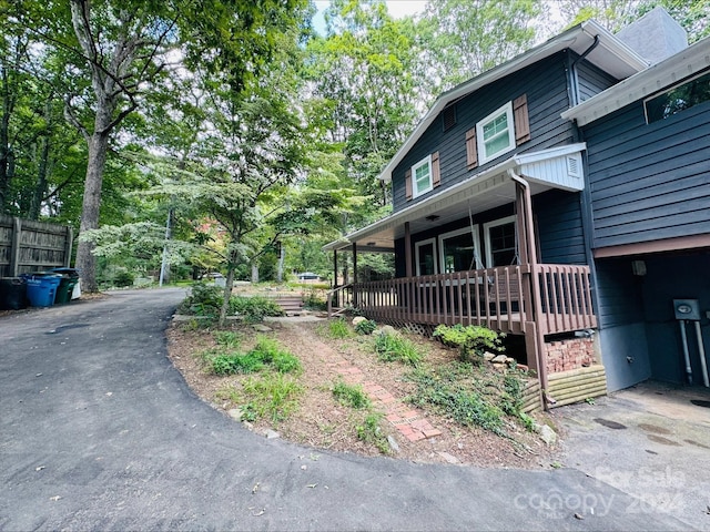 view of side of home with a porch