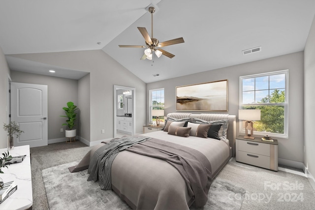 carpeted bedroom with connected bathroom, ceiling fan, and lofted ceiling