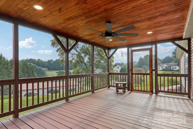 exterior space with a wealth of natural light, ceiling fan, and wood ceiling