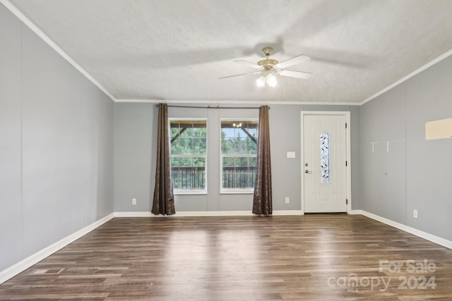 foyer with ceiling fan, crown molding, a textured ceiling, and hardwood / wood-style flooring