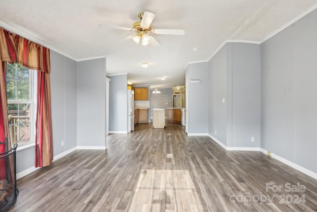 unfurnished living room with ceiling fan, crown molding, and hardwood / wood-style floors