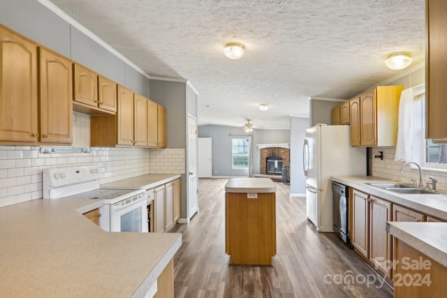 kitchen with sink, wood-type flooring, decorative backsplash, and white electric range