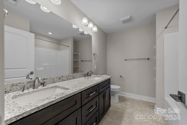 full bathroom featuring dual vanity, tub / shower combination, toilet, and tile patterned floors