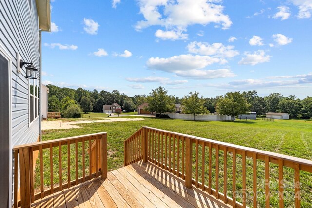 deck featuring a lawn