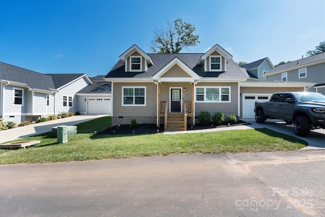 view of front of property featuring a front yard, crawl space, an attached garage, and concrete driveway