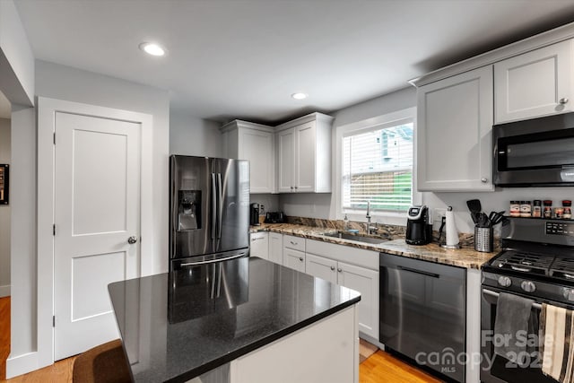 58 Greenwood Fields Dr, Asheville, NC 28804 - kitchen with recessed lighting, a sink, a center island, dark stone counters, and black appliances
