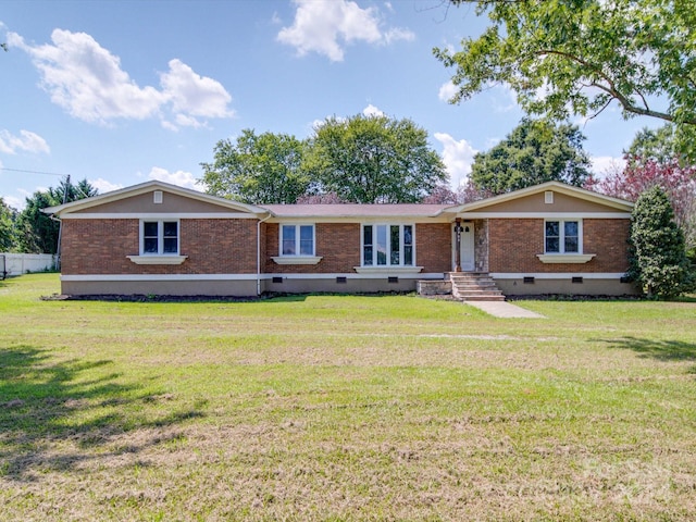 ranch-style house featuring a front lawn