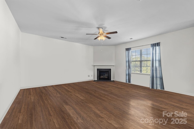 unfurnished living room featuring ceiling fan and wood-type flooring