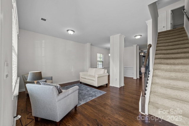 living room with ceiling fan and dark hardwood / wood-style floors