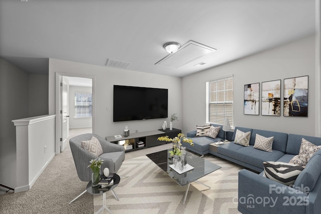 living room featuring light carpet and a wealth of natural light