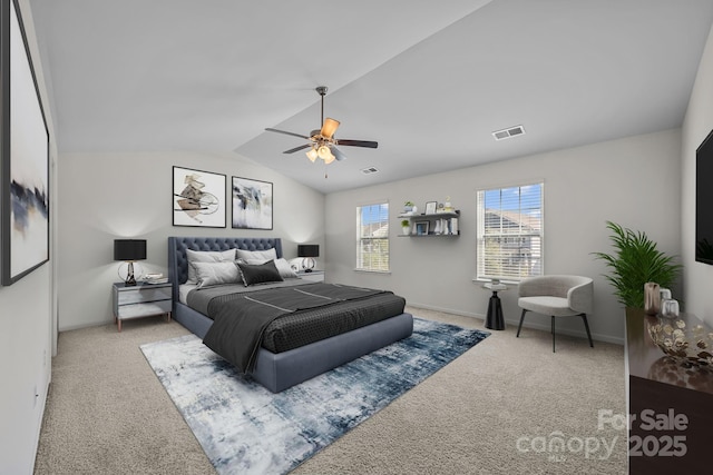 carpeted bedroom featuring ceiling fan and vaulted ceiling