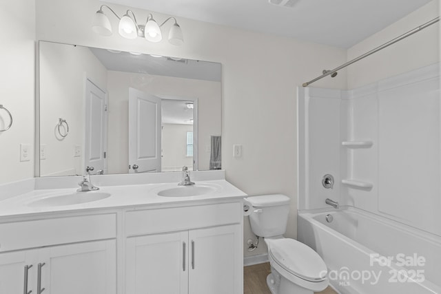 full bathroom featuring vanity, toilet, and shower / bathtub combination