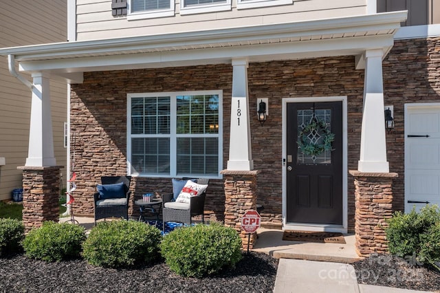 doorway to property featuring a porch