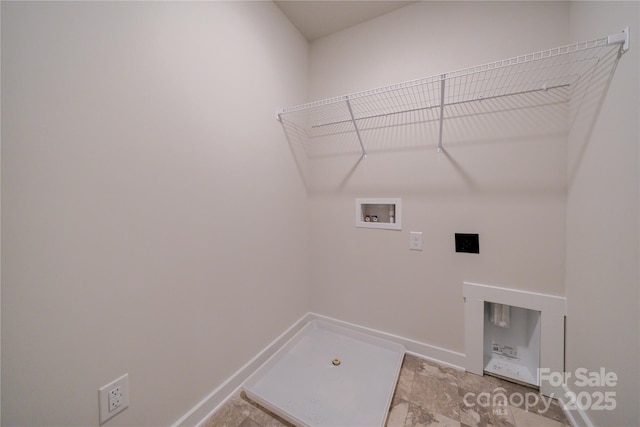 clothes washing area featuring laundry area, hookup for a washing machine, and baseboards