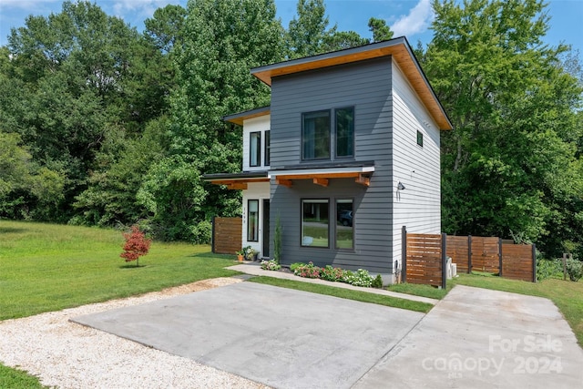 contemporary home with a front yard