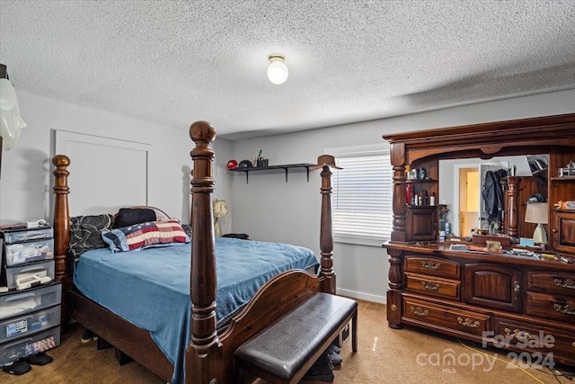 bedroom featuring a textured ceiling and baseboards