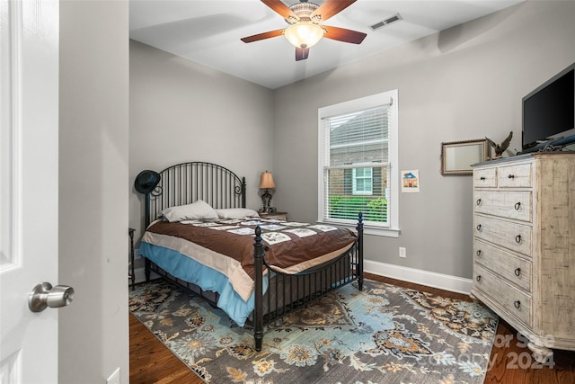 bedroom with ceiling fan and wood-type flooring