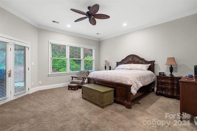 carpeted bedroom featuring ceiling fan, crown molding, and access to outside